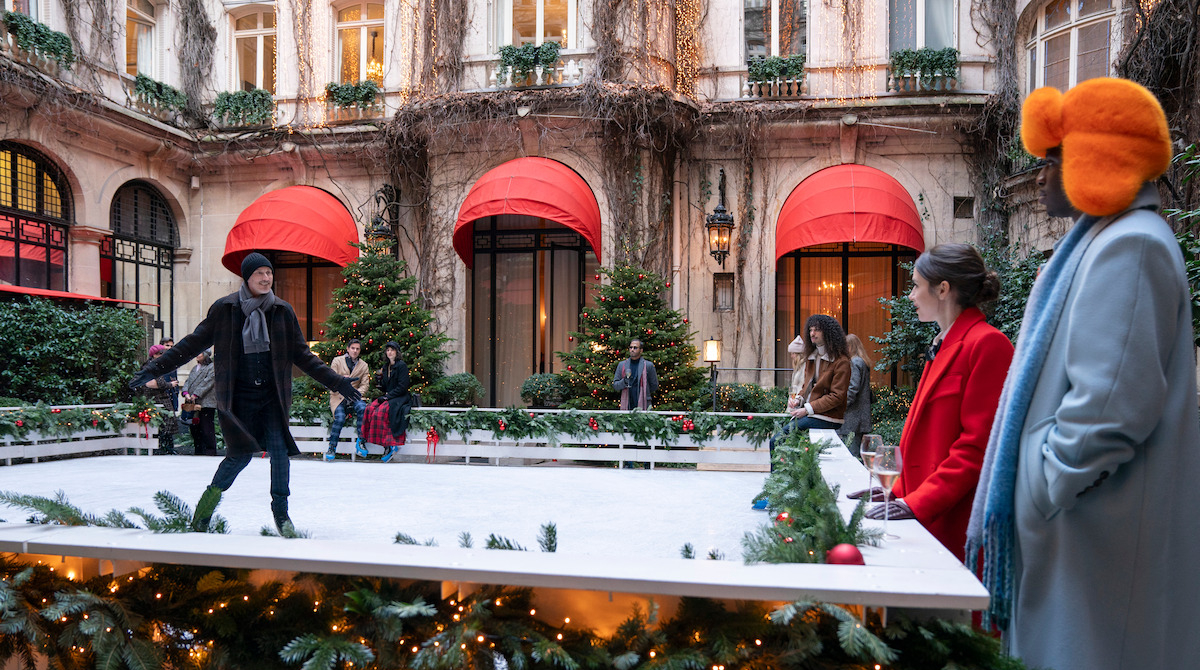 The usual suspects comprising Emily, Luc, and Julian at an Agence Grateau holiday party at Hôtel Plaza Athénée. (Photo: Tudum by Netflix)