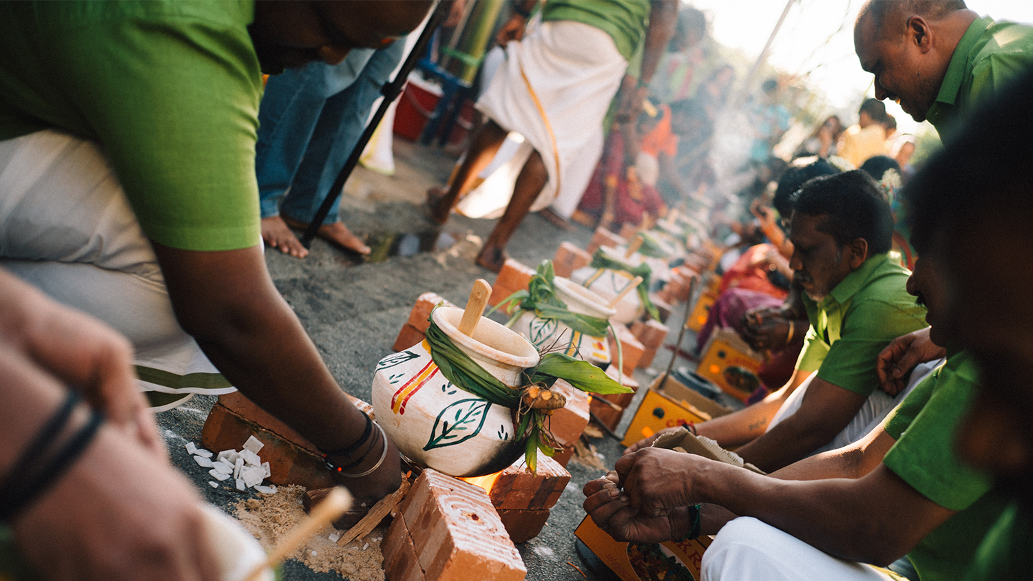 Families working together to create a vibrant celebration in Brickfields, Kuala Lumpur.