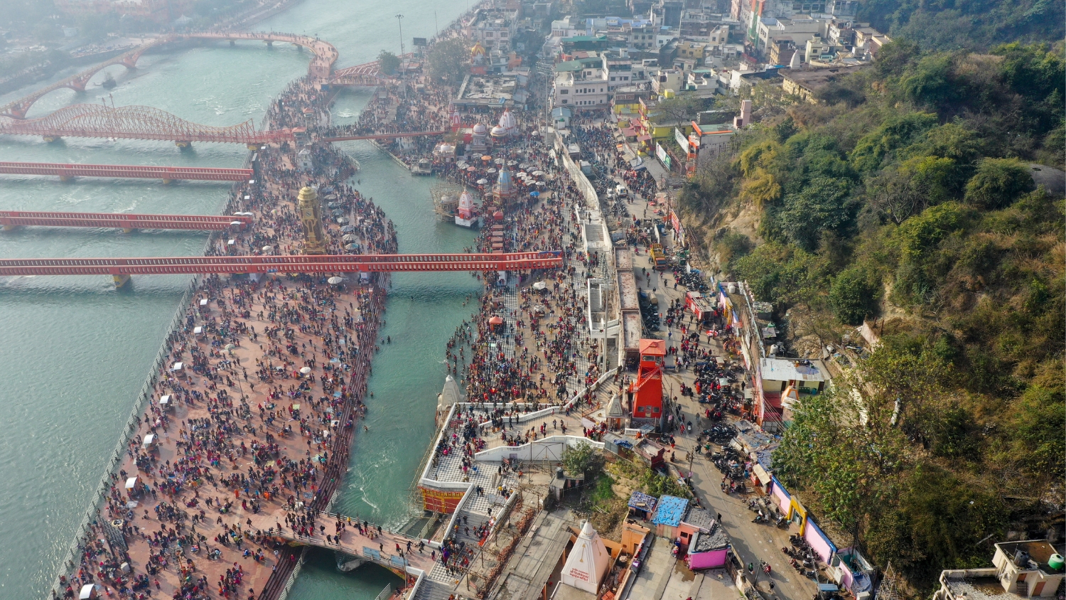 Pilgrims taking ritual baths during Maha Kumbh Mela. 