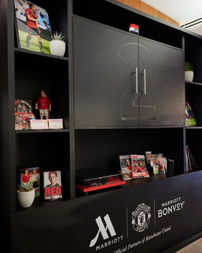 Display cases filled with cherished mementoes and iconic moments from Gary’s time as captain.