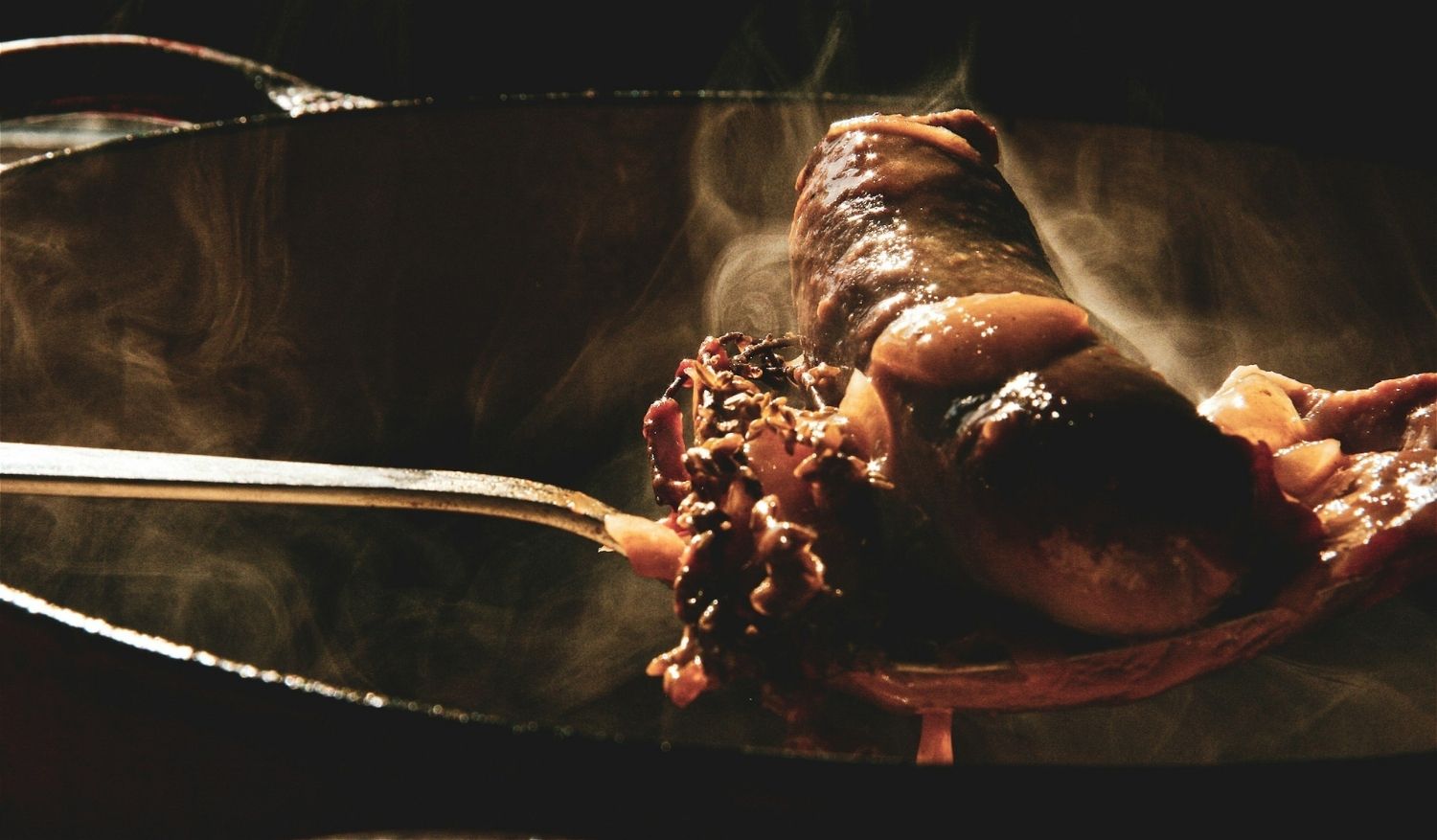 Cassoulet, a slow-cooked French stew that typically features white beans, duck confit, sausage, and pork. (Credit: Ben Wicks)