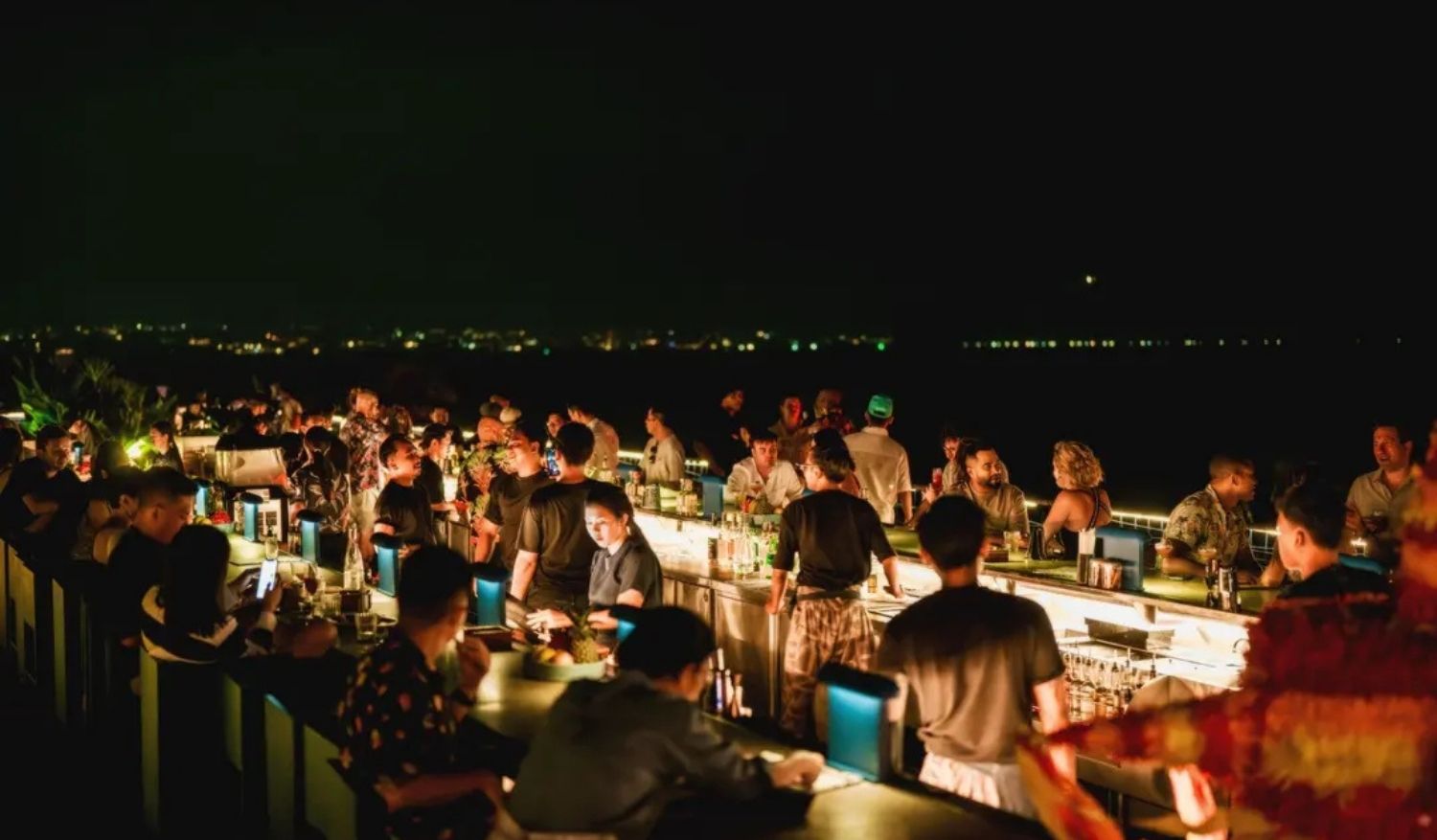 Potato Head's Rooftop Bar at night.