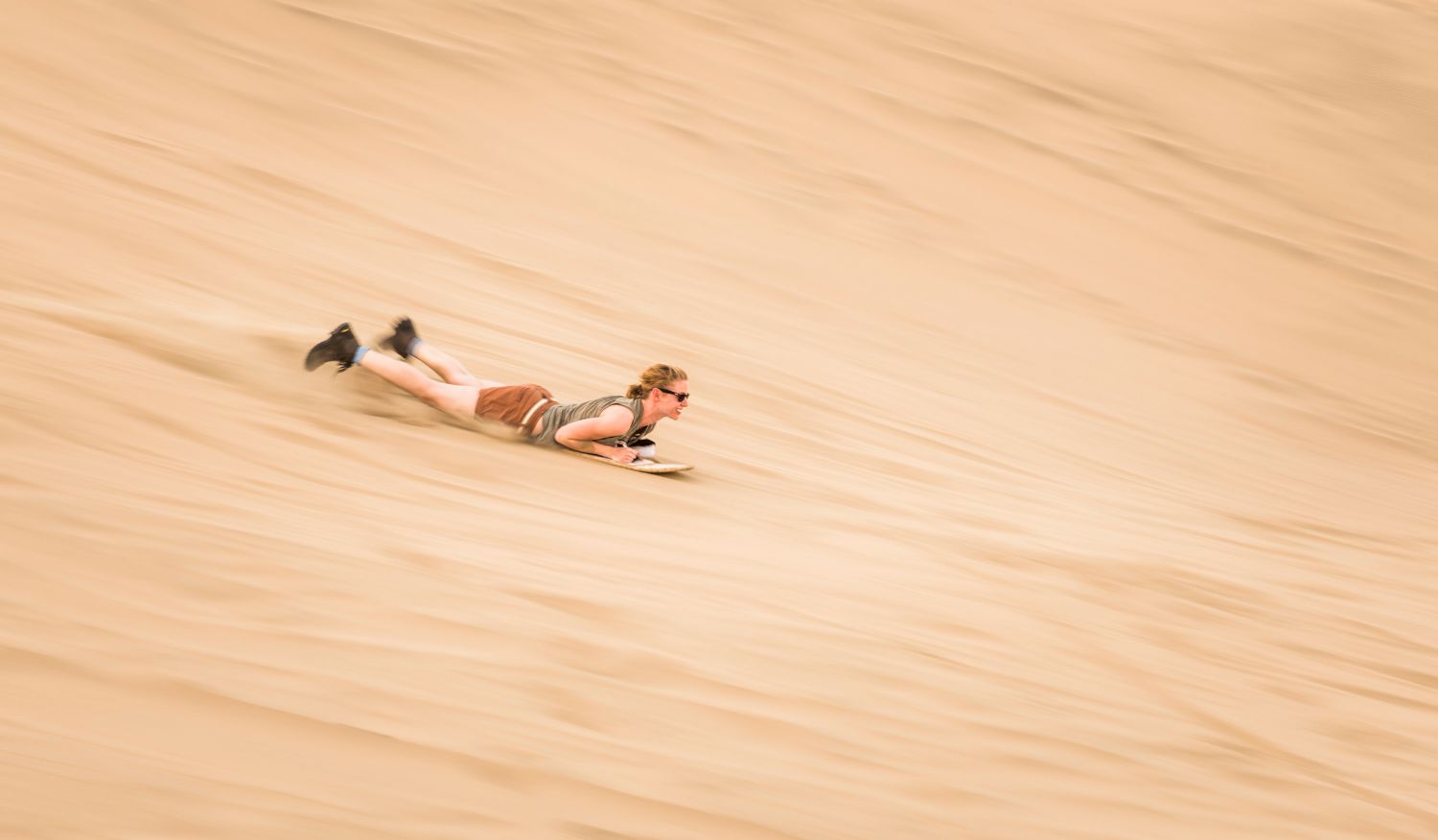 Sandboard down mammoth dunes that reach up to 250 metres.