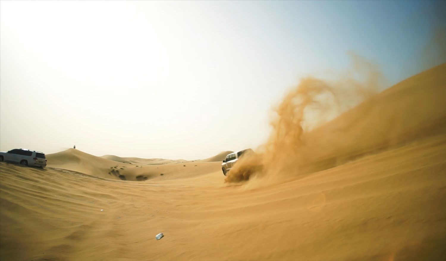 Skilled drivers navigate steep drops and sharp ridges in 4x4s.