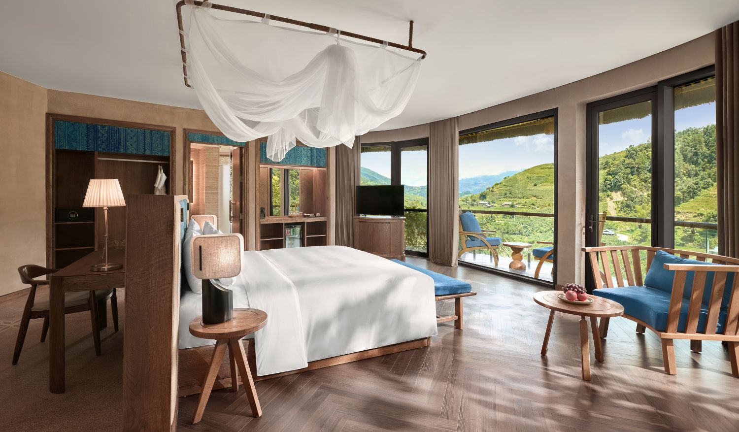 Floor-to-ceiling views of terraced valleys.